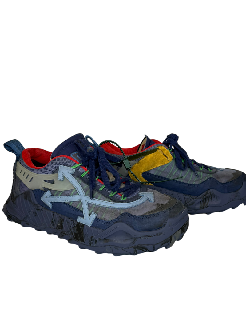 Off-White Odsy-1000 sneakers in navy, side view of the pair with light blue arrow logos and red-lined collars