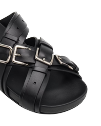 Loewe Type Fussbett sandal in black, detail close-up of the row of silver buckles on the crossed black leather straps