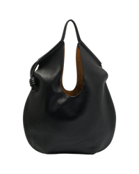 Loewe Paseo knotted leather tote in black, side view showing the knotted leather cord gathering the rounded body