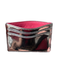 Schiaparelli Keyhole card holder in silver, angled back view with pink interior, two card slots and gold script logo
