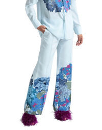 Valentino Garavani Macro Ortensia printed silk flared pants on model, front view with blue hydrangea print hem
