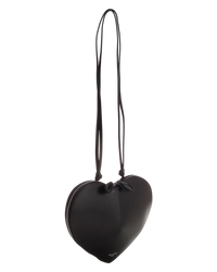 Alaïa Le Coeur leather shoulder bag in black hanging by its strap, showing the knotted leather tie at the top