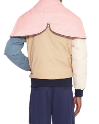 JW Anderson colorblock bomber jacket in multicolor on model, back view with pink logo hood collar and tan body