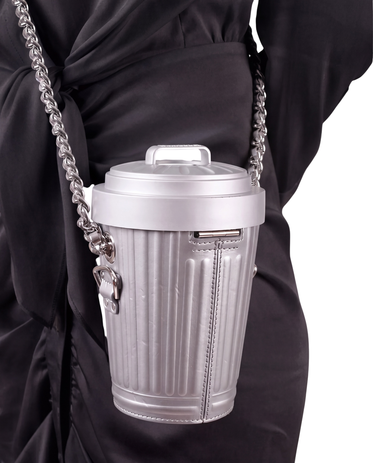 Moschino Trash Can chain shoulder bag in grey on model, worn crossbody on a chunky silver chain over a black dress