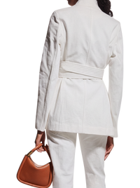 Gabriela Hearst Racer belted blazer in white on model, back view of the belted waist and textured weave