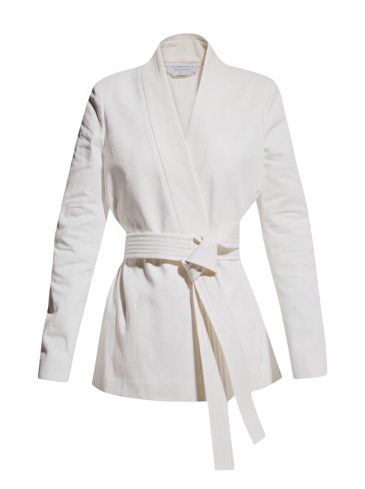 Gabriela Hearst Racer belted blazer in white, front flat view with wrap front and long tied belt ends