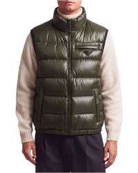 Prada quilted ripstop down gilet in green, front view on model zipped to the funnel neck over a cream knit, triangle logo at the chest pocket