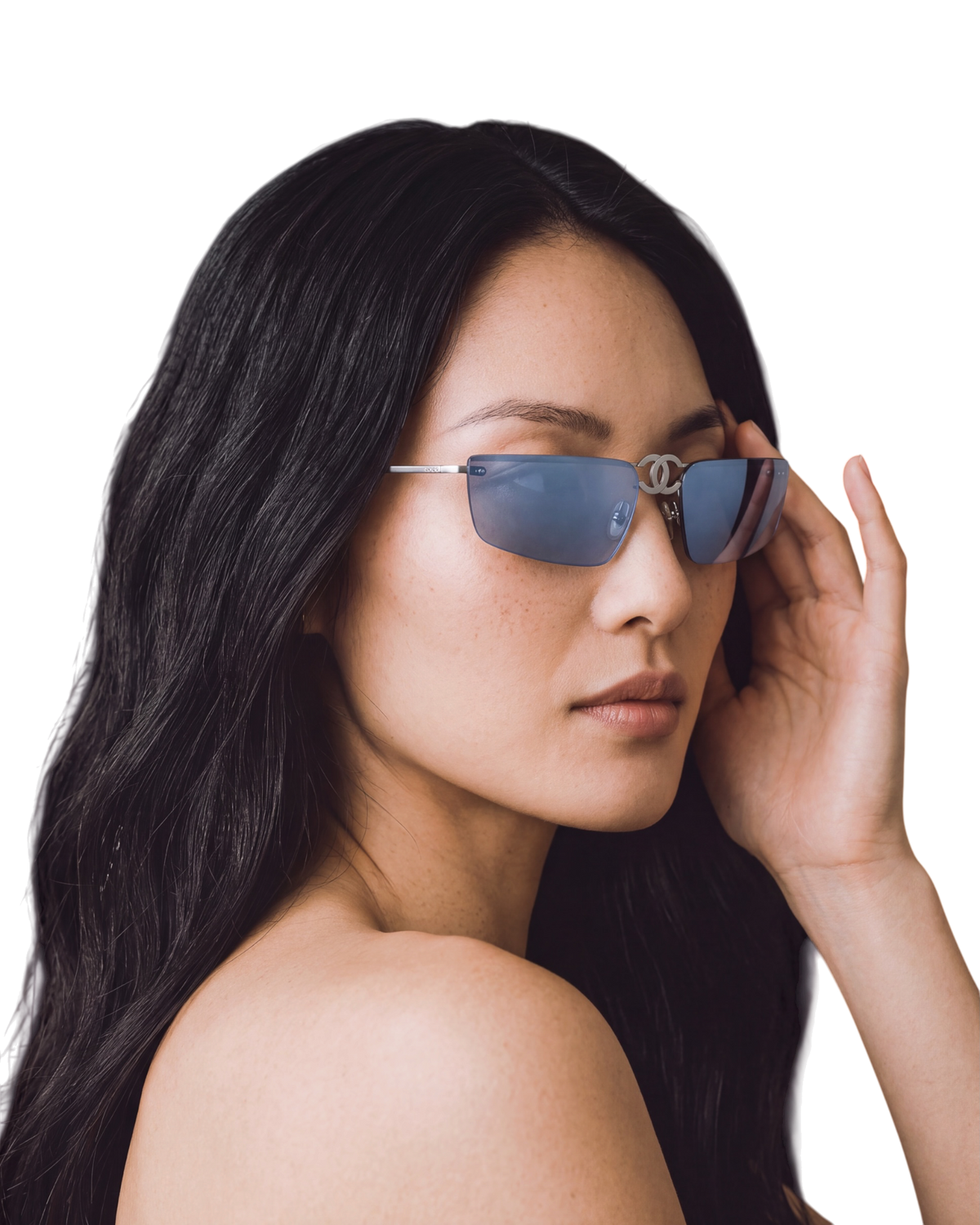 Chanel 4040 foldable rimless sunglasses in silver on model, slim blue lenses with CC logo at the temple