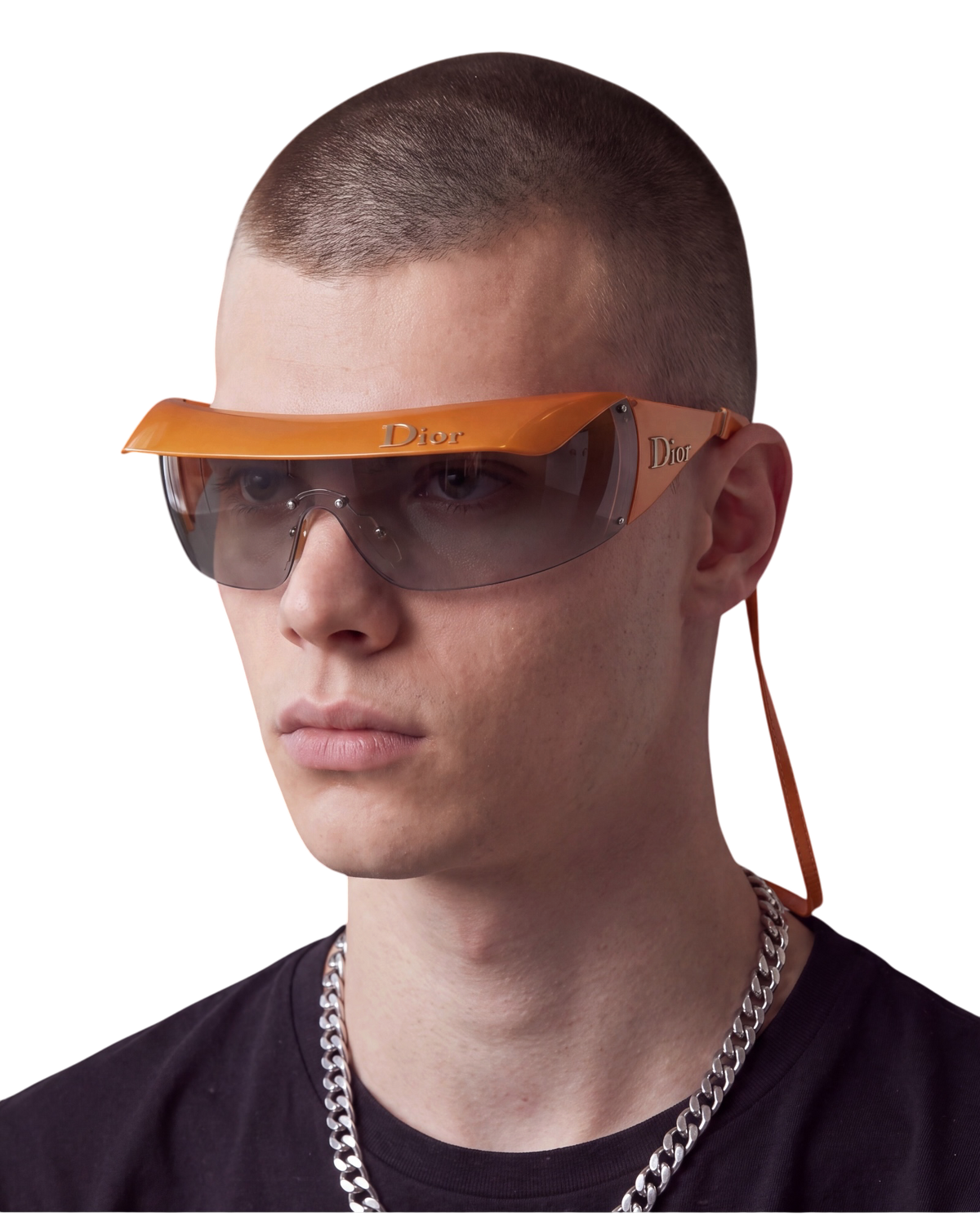Dior Golf shield sunglasses in orange on model, worn with the clip-on Dior visor and orange eyewear cord