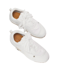 Loewe Deconstructed sneakers in soft white denim, top view of the pair with raw frayed laces and tan insoles