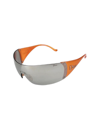 Dior Golf shield sunglasses in orange, angled view without the visor showing the silver shield and orange temples