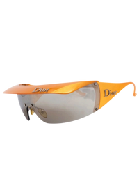 Dior Golf shield sunglasses in orange, side view with the brim visor attached and silver Dior logo on the temple
