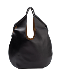 Loewe Paseo tote in black leather, front view with the handles drawn together, showing the tan suede-lined cut-out openings