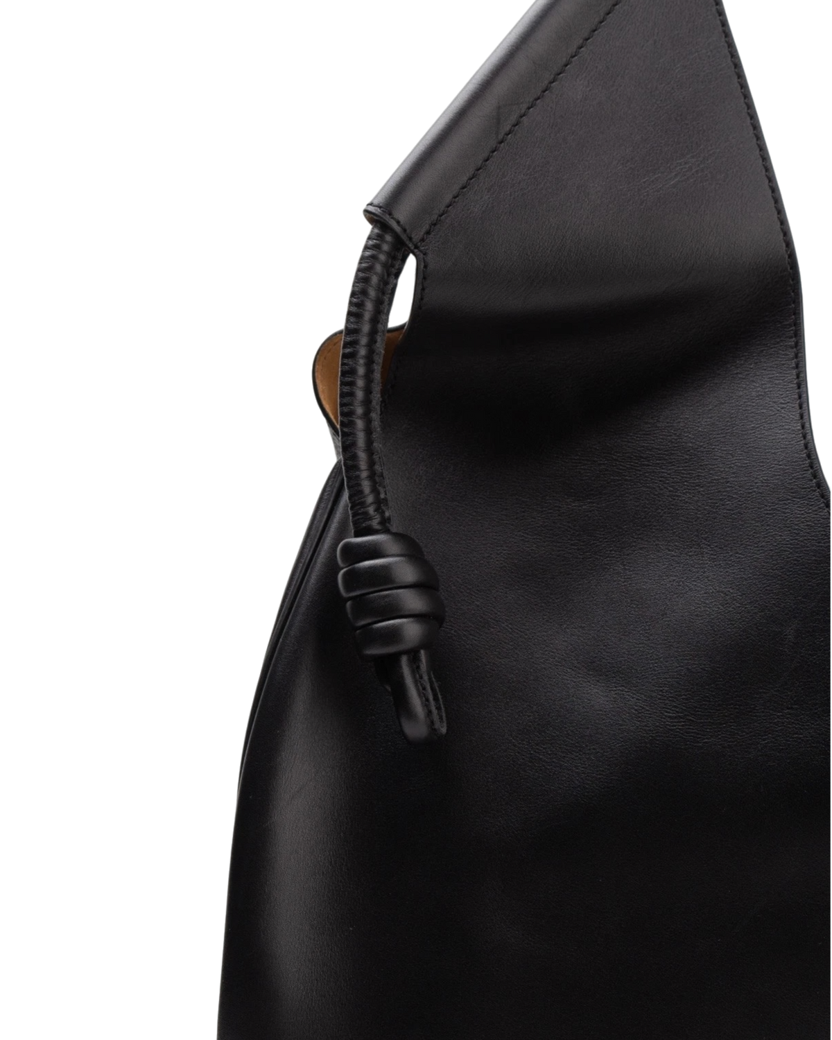 Close detail of the Loewe Paseo tote's coiled leather knot where the handle meets the body