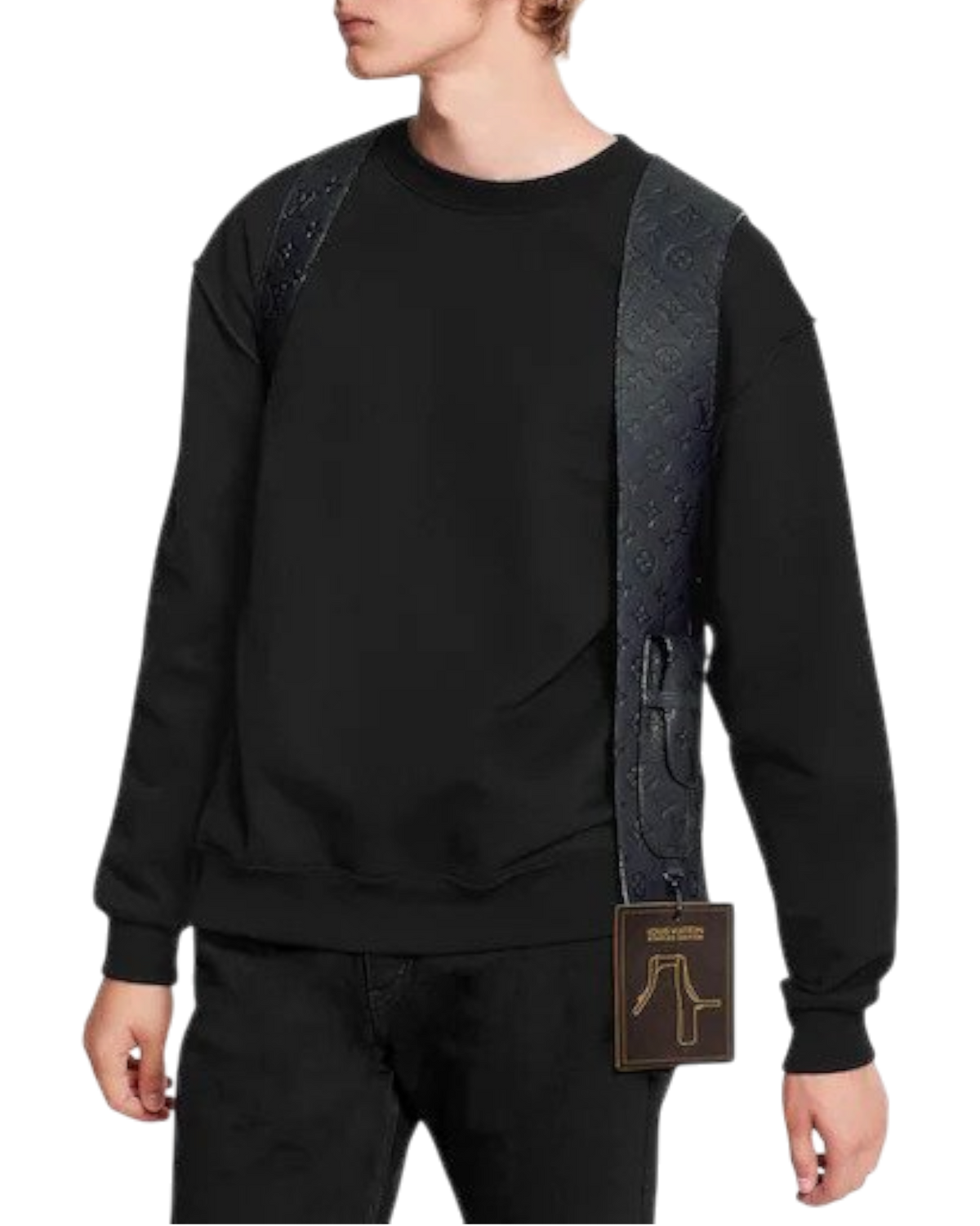 Louis Vuitton Cut Away Vest worn over a black crewneck, front view, showing the monogram embossed strap across the chest