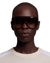 Phoebe Philo Bombé sunglasses in deep brown acetate with a domed, sculptural frame and dark brown tinted lenses.