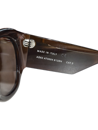 Interior temple detail of Phoebe Philo Bombé sunglasses in brown acetate showing Made in Italy and model markings.
