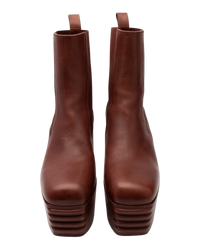 Front view of the Rick Owens Minimal Grill Chelsea boots, showing the squared toe and the ridged grill front edge of the platform