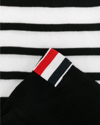 Close detail of the four-bar stripe and the red, white and navy grosgrain tab stitched at the sock cuff