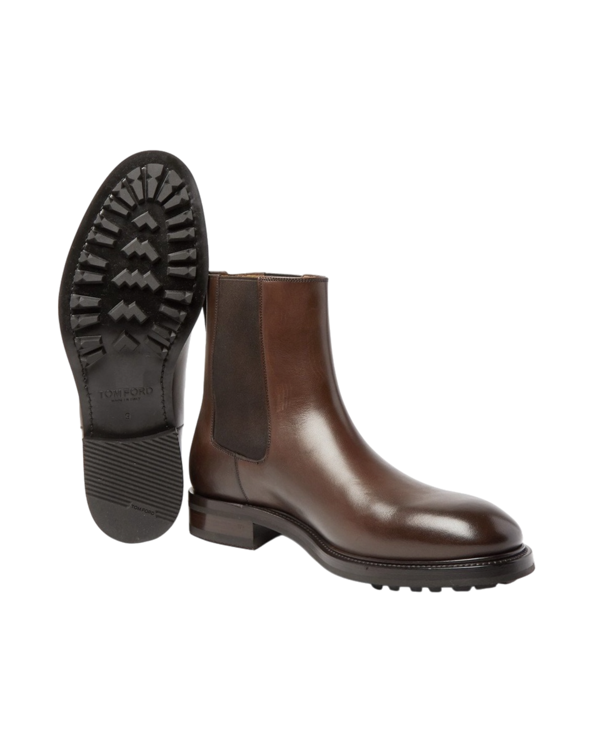 The pair with one boot tipped to show the lugged rubber outsole stamped TOM FORD, Made in Italy, size 11